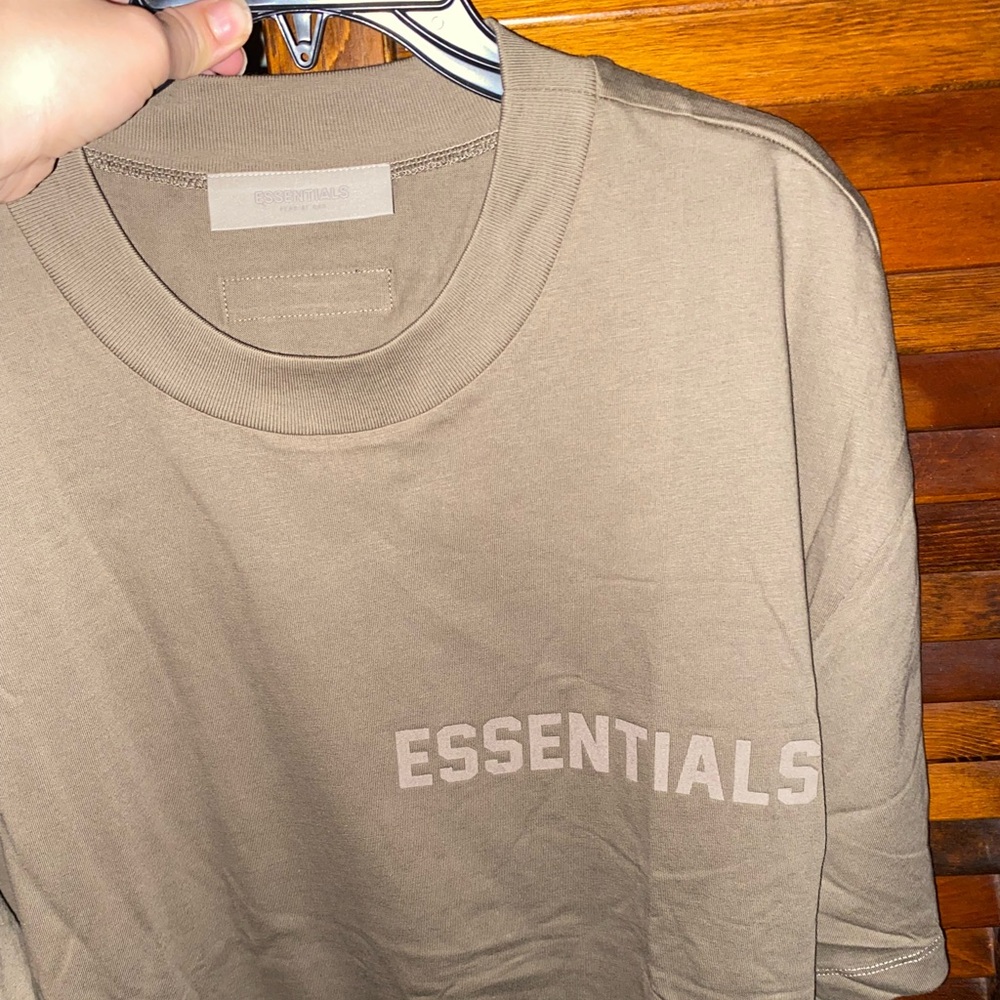 brand new Essentials fear of god shirt